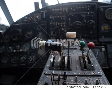 faded dials and gauges showcase vintage aircraft instrumentation and heritage, aging analog instruments with faded markings and glass glare evoke nostalgic aviation precision and tradition faded dials and gauges showcase vintage aircraft instrumentation and heritage, aging analog instruments with faded markings and glass glare evoke nostalgic aviation precision and tradition 132234698
