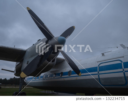 regional aircraft with static display outside, propellerdriven regional aircraft displayed outdoors on grassy field, faded livery regional propeller aircraft on grassy field in overcast regional aircraft with static display outside, propellerdriven regional aircraft displayed outdoors on grassy field, faded livery regional propeller aircraft on grassy field in overcast 132234715
