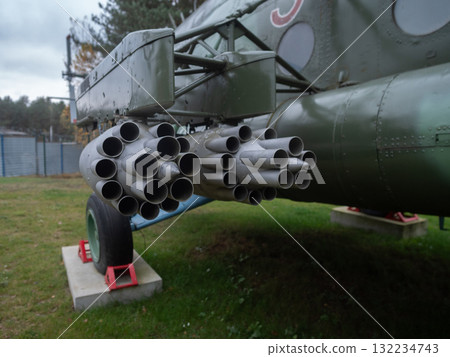 helicoptermounted rockets, mounted twin rocket pods on helicopter pylons indicate attack power, helicopter pylons equipped with twin rocket pods demonstrate attack capabilities and firepower 132234743