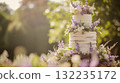 Wedding cake with lavender flowers. Holiday table decoration 132235172