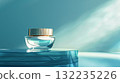 Cosmetic cream in a glass jar on blue backdrop. Skin care concept. Background for beauty products 132235226
