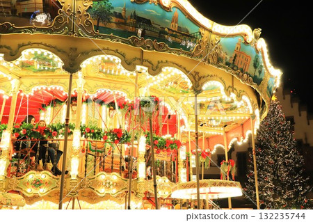 Illuminated merry-go-round at night 132235744