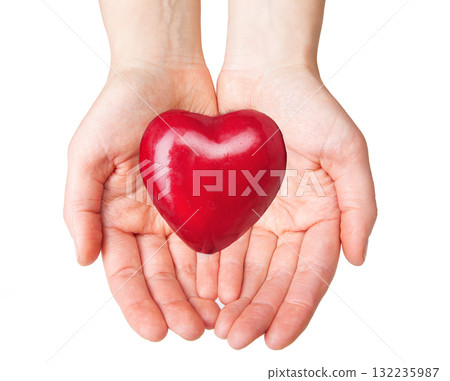 Close-up of hands gently holding heart-shaped red apple, symbolizing health, care, Close-up of hands gently holding heart-shaped red apple, symbolizing health, care, 132235987