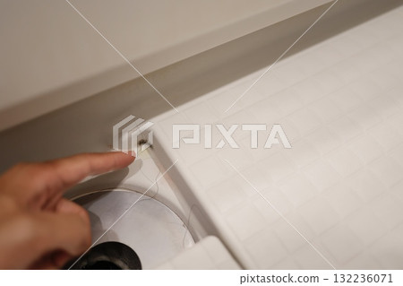 Black mold growing in the corner of the bathroom drain. 132236071