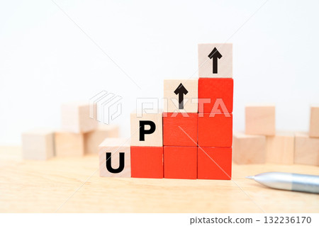 The red building blocks represent the concept of UP and an upward trend with an upward arrow. 132236170