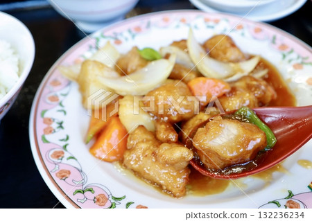 A close-up of sweet and sour pork, a classic Chinese side dish. A close-up of sweet and sour pork, a classic Chinese side dish. 132236234