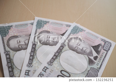 A row of 10,000 yen bills A row of 10,000 yen bills 132236251