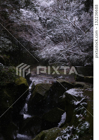 Rugged rocks upstream and accumulated snow 132236688