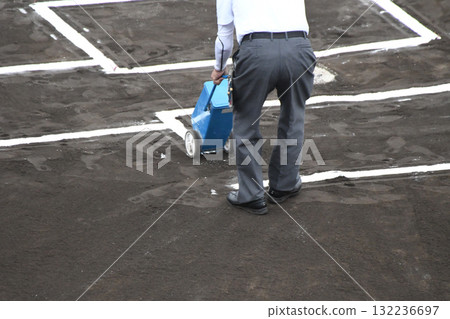 Referee drawing the line 132236697