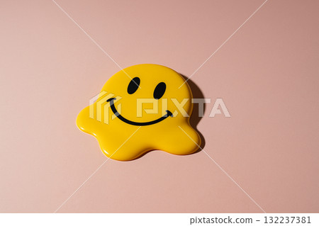 The melting smiley face symbolizes artificial happiness The melting smiley face symbolizes artificial happiness 132237381