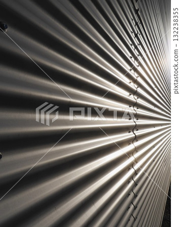 Metal wall with a series of ridges and grooves Metal wall with a series of ridges and grooves 132238355