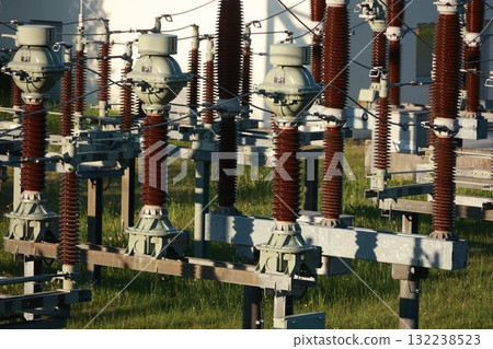 A bunch of power lines are in a field 132238523