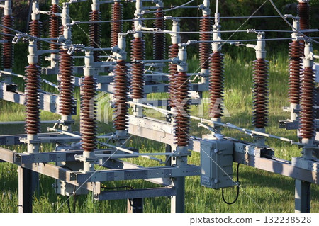 A power line pole with a brown and gray wire 132238528