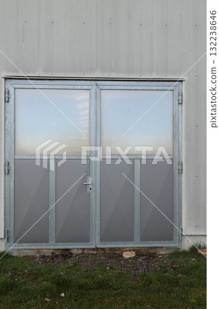 The door is made of glass and metal The door is made of glass and metal 132238646
