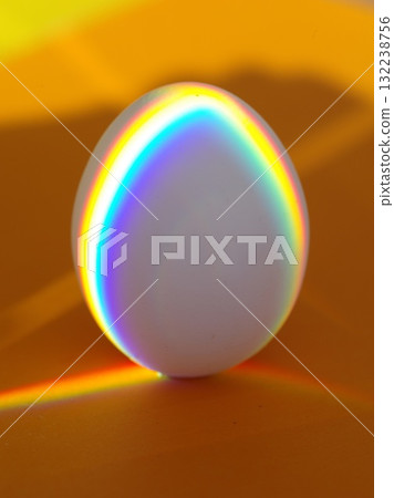 A white egg with rainbow colors on it 132238756