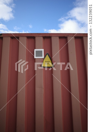 Red container with a yellow sign on it that says "No Entry" 132239051