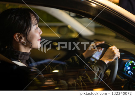 A woman driving a car A woman driving a car 132240072