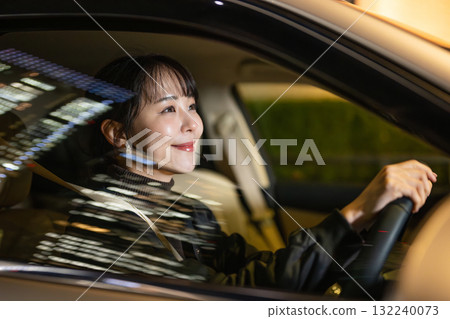 A woman driving a car A woman driving a car 132240073