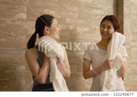 Exercise woman wiping sweat Exercise woman wiping sweat 132240677