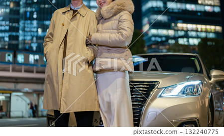 Men and women standing in the city at night 132240775