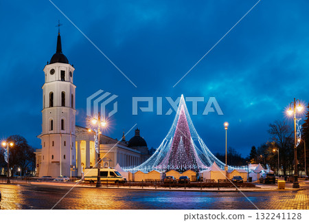 Vilnius, Lithuania. Christmas Tree On Background Bell Tower Belfry Of Vilnius Cathedral At Cathedral Square In Evening New Year Christmas Xmas Illuminations. Unesco World Heritage Site 132241128