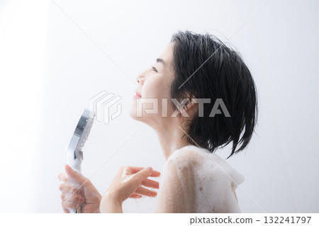 Image of a woman washing her body in a shower with beautiful water droplets Image of a woman washing her body in a shower with beautiful water droplets 132241797