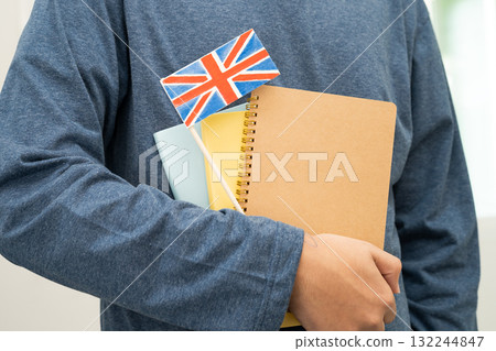 Learn English language, Asian teenage student hold book with flag in course at school. 132244847