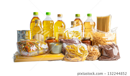 Foodstuff for donation, storage and delivery. Various food, pasta, cooking oil and canned food in cardboard box. 132244852