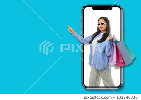 Young shopper showcases excitement while holding shopping bags Young shopper showcases excitement while holding shopping bags 132246336