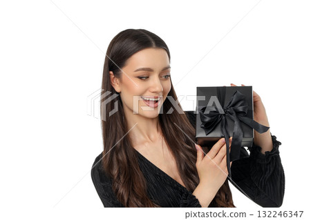 Joyful shopper with a black gift box for Black Friday, isolated, PNG 132246347