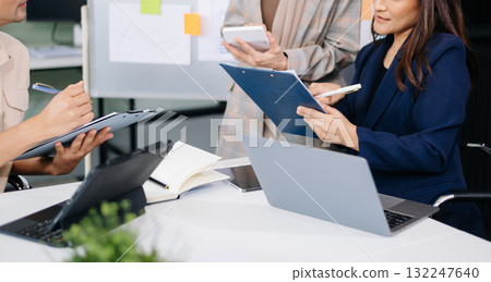 Business team discuss at meeting room. working together with laptop ,tablet and smart phone on desk Financial accountant at office Business team discuss at meeting room. working together with laptop ,tablet and smart phone on desk Financial accountant at office 132247640