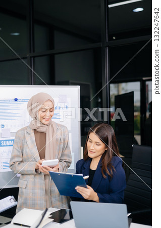 Business team discuss at meeting room. working together with laptop ,tablet and smart phone on desk Financial accountant at office Business team discuss at meeting room. working together with laptop ,tablet and smart phone on desk Financial accountant at office 132247642