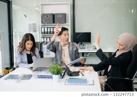 Furious Asian businesspeople arguing strongly after making a mistake at work in office 132247713