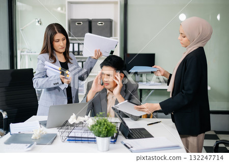 Furious Asian businesspeople arguing strongly after making a mistake at work in office Furious Asian businesspeople arguing strongly after making a mistake at work in office 132247714