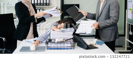 Furious Asian businesspeople arguing strongly after making a mistake at work in office 132247721