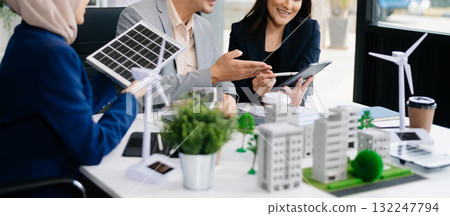 business team people planning and discussing on recycle reduce reuse policy symbol in office meeting room. Green business company and Solar Energy. 132247794