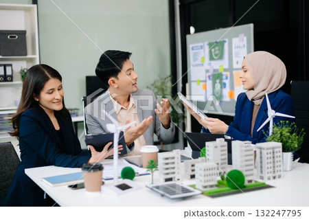 business team people planning and discussing on recycle reduce reuse policy symbol in office meeting room. Green business company and Solar Energy. business team people planning and discussing on recycle reduce reuse policy symbol in office meeting room. Green business company and Solar Energy. 132247795
