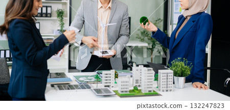 business team people planning and discussing on recycle reduce reuse policy symbol in office meeting room. Green business company and Solar Energy. 132247823