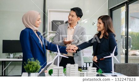 Business people having consultation about wind energy at company office. Business team discussing about windmill and alternative green enery. Net zero and carbon neutral concept 132247828