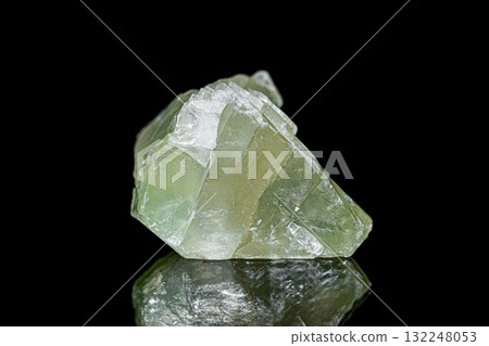 Green calcite on dark background 132248053
