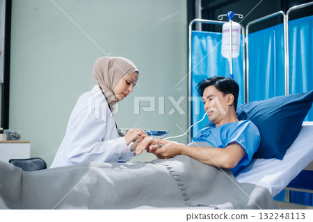 Muslim female doctors providing medical care in a modern clinic, with a focus on healthcare, patient treatment Muslim female doctors providing medical care in a modern clinic, with a focus on healthcare, patient treatment 132248113