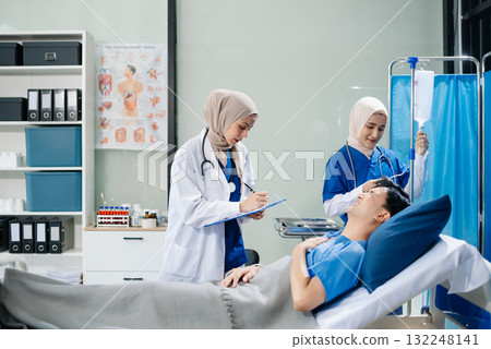 Muslim female doctors providing medical care in a modern clinic, with a focus on healthcare, patient treatment Muslim female doctors providing medical care in a modern clinic, with a focus on healthcare, patient treatment 132248141