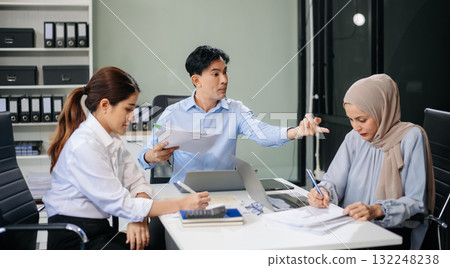 Furious team Asian businesspeople arguing strongly after making a mistake at work in office Furious team Asian businesspeople arguing strongly after making a mistake at work in office 132248238
