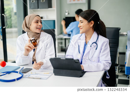 Doctor Talks With Professional Head Nurse or Surgeon, They Use Digital tablet Computer. Diverse Team of Health Care Specialists Doctor Talks With Professional Head Nurse or Surgeon, They Use Digital tablet Computer. Diverse Team of Health Care Specialists 132248334