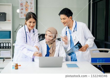 Medical professionals in modern clinic, discussing treatment and prescriptions. Healthcare, teamwork, consultation, diagnosis, and therapy and people team Medical professionals in modern clinic, discussing treatment and prescriptions. Healthcare, teamwork, consultation, diagnosis, and therapy and people team 132248346
