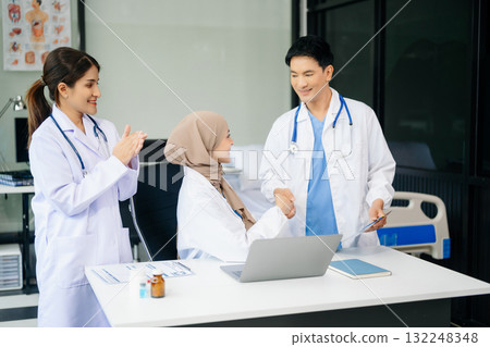 Medical professionals in modern clinic, discussing treatment and prescriptions. Healthcare, teamwork, consultation, diagnosis, and therapy and people team 132248348