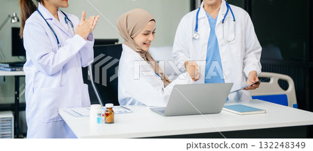 Medical professionals in modern clinic, discussing treatment and prescriptions. Healthcare, teamwork, consultation, diagnosis, and therapy and people team Medical professionals in modern clinic, discussing treatment and prescriptions. Healthcare, teamwork, consultation, diagnosis, and therapy and people team 132248349