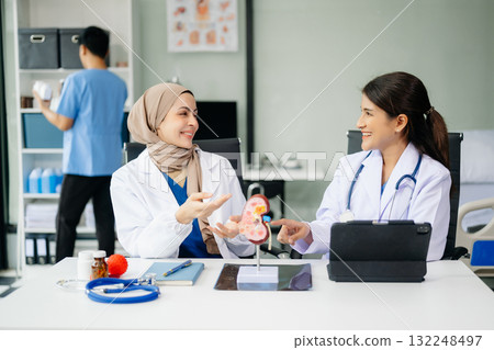 Doctor Talks With Professional Head Nurse or Surgeon, They Use Digital tablet Computer. Diverse Team of Health Care Specialists Doctor Talks With Professional Head Nurse or Surgeon, They Use Digital tablet Computer. Diverse Team of Health Care Specialists 132248497