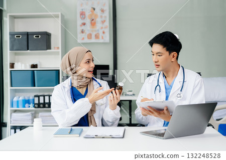 Medical, meeting and doctors with laptop for research, planning and hospital schedule management. Health, professional and people team 132248528