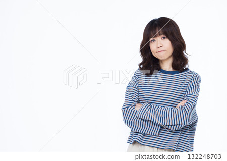 A woman in trouble with her arms folded 132248703